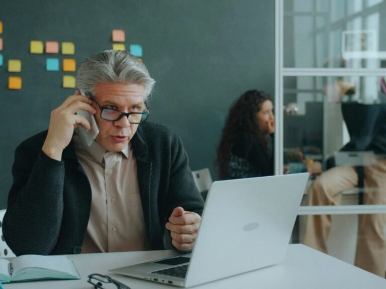 Business owner reviewing an SEO audit on his laptop