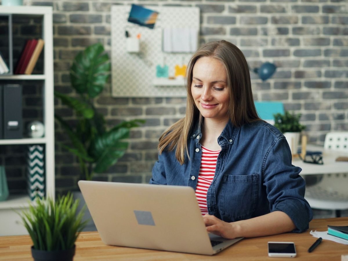 SEO specialist optimizing a client website at her desk