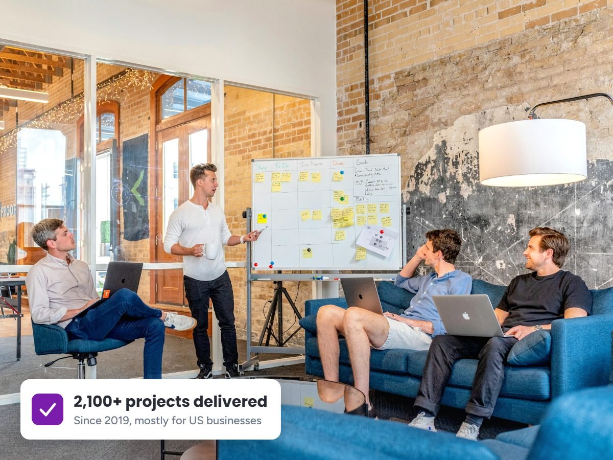 White hat SEO agency team collaborating in a shared workspace